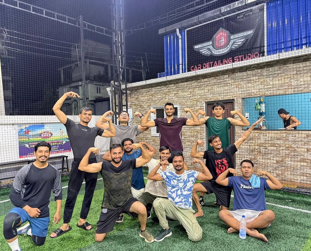 Members of Yogesh Fit Nation flexing together